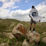 Nathaniel Buzolic Instagram - Traveling through the Jordan valley on my way to the Galilee I stopped to pray and take in this view. Im wearing a custom made Tallit which is a traditional prayer shawl in Judaism made by @tallis_man truly a one of a kind gift. Made in the traditional way by hand from the heart of Israel.