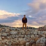 Nathaniel Buzolic Instagram - I’m standing at the ancient ruins of Tel Shilo.. This was one of the most spectacular sunsets I have seen in Israel to date. My group was watching a interactive video inside the visitors center and I had a moment to take in this place and what God was doing with the people who lived here. Hannah’s prayer would be answered here in first Samuel and Samuel the prophet would bring about a new age In the Israelite story. He would pave the way for a king to be anointed. It’s been a long year for me, I’m exhausted. I’m writing this caption at yet another airport lounge waiting for yet another delayed flight. But tomorrow when I return to Sydney I’m going to set myself another challenge. A 35 day Old Testament task. And I want you to join me. From genesis to Malachi read for an hour and a half each day to get through God’s story before the messiah would enter into our stories. Follow @palmsundaysco for my person insights each day