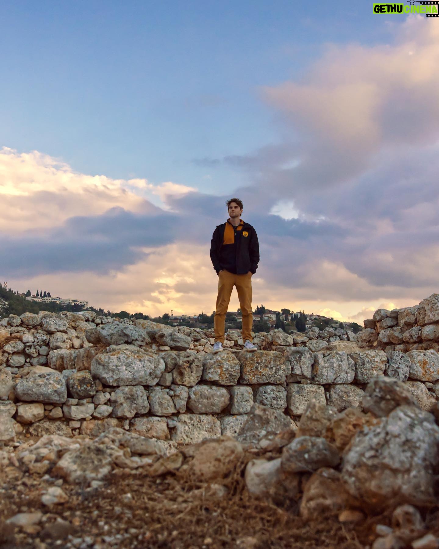 Nathaniel Buzolic Instagram - I’m standing at the ancient ruins of Tel Shilo.. This was one of the most spectacular sunsets I have seen in Israel to date. My group was watching a interactive video inside the visitors center and I had a moment to take in this place and what God was doing with the people who lived here. Hannah’s prayer would be answered here in first Samuel and Samuel the prophet would bring about a new age In the Israelite story. He would pave the way for a king to be anointed. It’s been a long year for me, I’m exhausted. I’m writing this caption at yet another airport lounge waiting for yet another delayed flight. But tomorrow when I return to Sydney I’m going to set myself another challenge. A 35 day Old Testament task. And I want you to join me. From genesis to Malachi read for an hour and a half each day to get through God’s story before the messiah would enter into our stories. Follow @palmsundaysco for my person insights each day