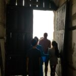 Nicole Ari Parker Instagram - Today my heart pounded as I stood in front of one of the two small windows...the only shaft of light..the only brief gust of wind inside the small female dungeon at #CapeCoastCastle. The spot that hundreds of shackled women surrounded by their dying sisters and children were forced in desperation to fight for... beg for..die for. A brief moment in the sun. A long visit to #CapeCoastCastle and #ElminaCastle was what I needed Sophie and Nicolas to experience. To see. To listen. To understand. They are two of the last remaining sites along the GoldCoast that bear witness to over 300 years of the brutality and horrors of the slave trade. We saw the powerful Nkyinkyim installation by artist Kwame Akoto-Bamfo depicting in terracotta the faces of people enslaved here. We walked thru the Door of No Return, following the path our ancestors took as they boarded ships. Then our guide #MrBlankson turned us around and we went back thru the same door...symbolizing our return. When we arrived at #ElminaCastle and Sophie saw the tiny door she had only read about..We stood in silence and then we prayed. 🇬🇭 Namanom yɛ hyɛ him ɛnyimnyam, yɛ da hom ase dɛ homdze bin aba fie.🇬🇭 Ancestors we honor you. We thank you for bringing us home.