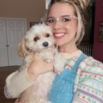 Nicole Franzel Instagram - My little Paris is so stinkin’ cute and funny. She gives off ditzy vibes but she’s actually just playing you for more treats. 😝 Best cuddles, softest fur, cutest face, and biggest adventurer. I’m so lucky to have you in my life!! 15 years and counting 🥹🐶🫶🏻🩷 she’s also the feisty one. 😜