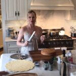 Nicollette Sheridan Instagram – Me preparing the English raspberry trifle with friends and family ❤️🎄🎁 #christmas #happyholidays #love #family #cooking