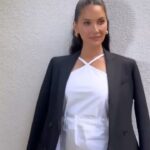 Olivia Munn Instagram - I honestly can’t believe I’ve been getting dressed up more and more. Thought I’d live in my robe forever after baby. 🤍🖤 Dress: @proenzaschouler Coat: @therow Boots: @paristexas_it Earrings: @_jennybird Styled by: @laurenjeworski Makeup: @dianebuzzetta Hair: @justinemarjan Nails: @nailsbyshige