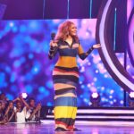 Osas Ighodaro Instagram - In Living Color …. w/ ‘Overall Best’ 🖤💛💙🤎♥️ 📸 | @photogirlnaija 💄 | @t.alamodebeauty 💇🏾‍♀️ | @touchofibee 👗 | @mosesebite 🎤 | @africamagic ‘Overall Best’ #OsasIghodaro #AMOverallBest #Host #vibes #blessed 💥