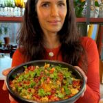 Padma Lakshmi Instagram - Chaat is Indian street food traditionally eaten from a cart, these days you can find it in many restaurants, stalls, canteens and made at home. I grew up eating from all sorts of street stalls when I grew up and I credit chaat for my gut being what it is today! There are many types of chaat with varying ingredients (papdi chaat, bhel puri, and pani puri to name a few), but it is always a beautiful mix of a lot of flavors and textures in one bite. Many of the ingredients repeat but the effect should always be spicy, sweet, tangy, hot and tart flavors exploding in your mouth. When I first started eating nachos in California as a young girl, I thought, “these nachos are just Mexican chaat!”The crunch of the tortilla chips, the wonderful gooey saltiness of cheese, topped with cold, tart, spiky pico de gallo, the sour punch from the lime, the heat from the chiles. I’ve always loved making my own nachos, so it was only a matter of time before chaat-chos would happen!!