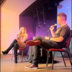 Patricia Stratigeas Instagram - Still buzzing from my stage events as part of the #BadGirlTourUK! Scotland … England… you were incredible!! Thanks for taking a stroll along memory lane with me. We laughed, we heckled, we cussed .. then we got on stage! Haha! But in all seriousness, the meet and greets were beyond special to me. Getting to spend time with each and every one of you and hearing your stories and how we are connected is something that will always stay with me. Thanks for making this our first stage events a success! Standing room only whaaat?? 🎉 @primetimeappearances A huge thanks to @kennymcitr for being the perfect host on and off the stage! And the @inside_theropes team - you guys rule! Top notch!! My girl @petite_pikahh and I felt the love! Oh and special shoutout to my girl @_jenlouise_ who I got to hang with on her birthday! Remember .. I will always care-a-lot about you 😘💗 Styled by @aliciasmcn Wearing @cityluxboutique (rust onesie)