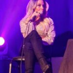 Patricia Stratigeas Instagram – Still buzzing from my stage events as part of the #BadGirlTourUK! Scotland … England… you were incredible!! Thanks for taking a stroll along memory lane with me. We laughed, we heckled, we cussed .. then we got on stage! Haha! But in all seriousness, the meet and greets were beyond special to me. Getting to spend time with each and every one of you and hearing your stories and how we are connected is something that will always stay with me. Thanks for making this our first stage events a success! Standing room only whaaat?? 🎉 @primetimeappearances 

A huge thanks to @kennymcitr for being the perfect host on and off the stage! And the @inside_theropes team – you guys rule! Top notch!! My girl @petite_pikahh and I felt the love! 

Oh and special shoutout to my girl @_jenlouise_ who I got to hang with on her birthday! Remember .. I will always care-a-lot about you 😘💗

Styled by @aliciasmcn 
Wearing @cityluxboutique (rust onesie)