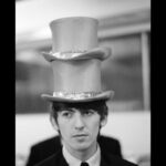 Paul McCartney Instagram - George with two hats. London "It’s what makes life great: when you look back and you think, ‘Wow, we did that. We did all of that, and we’re just kids from Liverpool." - Paul 🎟️ Paul McCartney Photographs 1963–64: #EyesOfTheStorm @nationalportraitgallery in London until October 1st. Tickets for the last remaining weeks are available now via the link in bio.