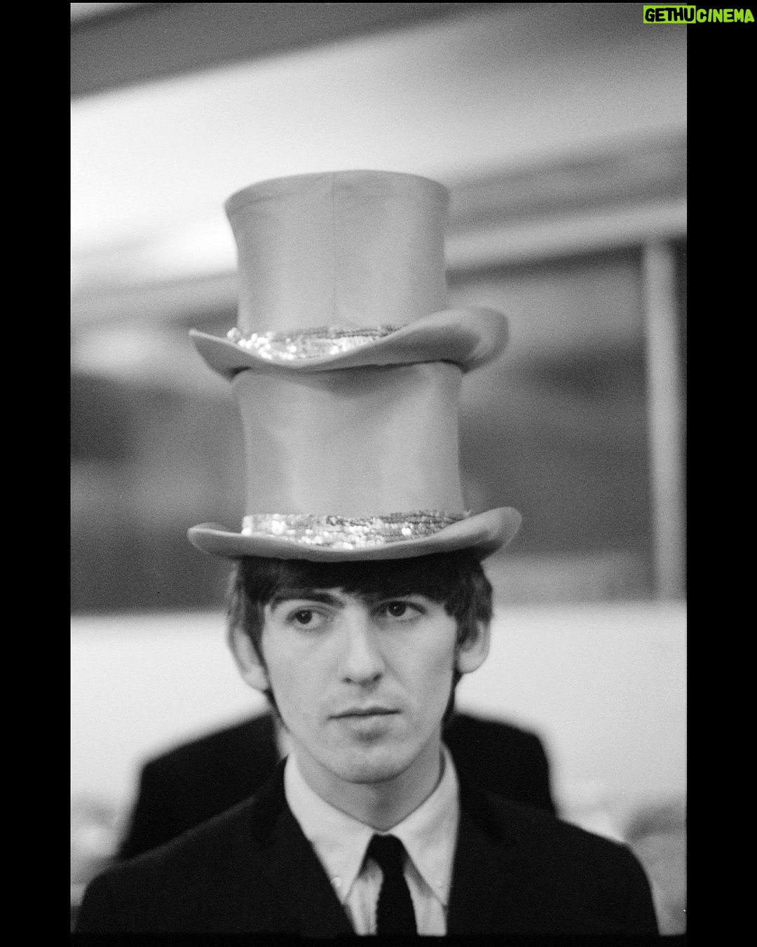 Paul McCartney Instagram - George with two hats. London "It’s what makes life great: when you look back and you think, ‘Wow, we did that. We did all of that, and we’re just kids from Liverpool." - Paul 🎟️ Paul McCartney Photographs 1963–64: #EyesOfTheStorm @nationalportraitgallery in London until October 1st. Tickets for the last remaining weeks are available now via the link in bio.