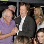 Paul McCartney Instagram - It seems that so many wonderful people are leaving this world, and now Jimmy Buffett is one of them. I’ve known Jimmy for some time and found him to be one of the kindest and most generous people. I remember once on holiday when I had forgotten to bring my guitar and was itching to play. He said he would get me one of his, but I said, ‘I’m left-handed’. So, Jimmy had his roadie restring one of his guitars which he loaned me for the duration of the holiday. He then followed this act of generosity by giving me my own beautiful left-handed guitar that had been made by one of his guitar-making pals. It’s a beautiful instrument, and every time I play it now it’ll remind me of what a great man Jimmy was. He had a most amazing lust for life and a beautiful sense of humour. When we swapped tales about the past his were so exotic and lush and involved sailing trips and surfing and so many exciting stories that it was hard for me to keep up with him. Right up to the last minute his eyes still twinkled with a humour that said, ‘I love this world and I’m going to enjoy every minute of it’. So many of us will miss Jimmy and his tremendous personality. His love for us all, and for mankind as a whole. Last, but not least, is his songwriting and vocal ability. If someone made an interesting remark he repeated it in his gorgeous Louisiana drawl and said, ‘That’s a good idea for a song’. Most times it didn’t take too long for that song to appear. I was very happy to have played on one of his latest songs called ‘My Gummy Just Kicked In’. We had a real fun session and he played me some of his new songs. One, in particular, I loved was the song, ‘Bubbles Up’. And I told him that not only was the song great but the vocal was probably the best I’ve heard him sing ever. He turned a diving phrase that is used to train people underwater into a metaphor for life when you’re confused and don’t know where you are just follow the bubbles - they’ll take you up to the surface and straighten you out right away. So long, Jim. You are a very special man and friend and it was a great privilege to get to know you and love you. Bubbles up, my friend. Love, Paul Photograph by Rob Rich