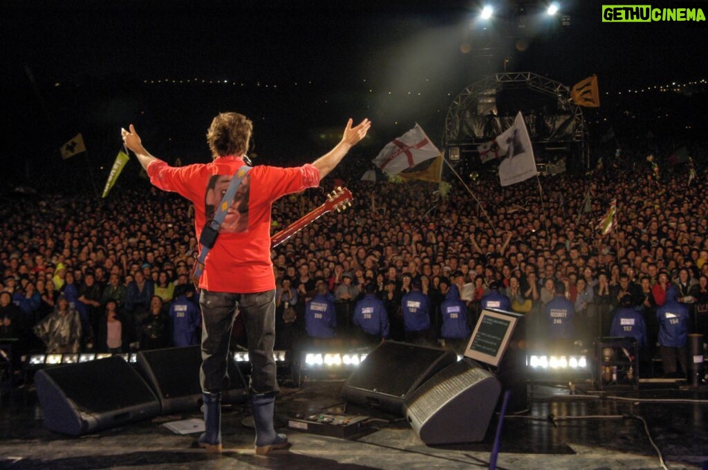 Paul McCartney Instagram - Paul performing at Glastonbury Festival, 2004.⁣ ⁣ "The crowds at Glastonbury have always reminded me of a medieval battle scene - it looks very heraldic, and to see this iconic scene and particular Glastonbury ‘look’ was very exciting.” - Paul⁣ ⁣ Less than 90 days until Paul returns to @glastofest headlining the iconic Pyramid Stage on Saturday 25th June! 🎸⁣ ⁣ #TBT #ThrowbackThursday #Glastonbury