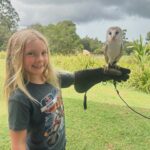 Pink Instagram – Its an absolute JOY to travel with my kids and be able to show them different lands and customs and culture and peoples and animals. Today was our second time visiting @lonepinekoala and it was amazing to understand and learn so much about koalas, Roos, dingos and raptors. For instance- barn owls fly silently and falcons are the fastest animal on Earth. Clocking in at 241 mph in flight. That’s fast. Also, barn owls enjoy being sung to, while kangaroos really just prefer grass and quiet time. And these tiny, brown, round balls in the field aren’t chocolate like @hartluck said they were.