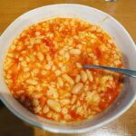 Rachel Bilson Instagram - Rainy day in LA, thought I’d post my recipe for “pasta fazul”. It’s a super easy cozy dish that only takes what you probably already have on hand. Carrots (chopped, I used 4) Onion (half of large onion chopped) Garlic (I smashed about 6 cloves) Chicken broth (4 cups) Tomato sauce (I used Raos marinara) Cannellini beans (I used 3 cans, they’re also called white kidney beans) Parmesan Any kind of tiny pasta Sautée the first three, then add beans, I also add the liquid from beans from 2 out of the three cans. Then add broth and sauce, simmer for an hour or so. Boil water, cook pasta then add at end and top with Parmesan!