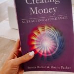 Rachel Hollis Instagram - Many of us were made to fear money from the time we were small. We grew up in homes where money or food or security were uncertain. We learned to fear finances because there was never enough, and the adults around us were always stressed by the lack. ⠀⠀⠀⠀⠀⠀⠀⠀⠀ If you’re not conscious of it, you’ll bring that same belief system into your adult life and recreate the “reality” you grew up seeing. ⠀⠀⠀⠀⠀⠀⠀⠀⠀ I found this book (Creating Money / Attracting Abundance by Sanya Roman Duane Packer) on a shelf in Sedona and it’s the best thing I’ve EVER read about abundance — not just financial abundance but relationships, health, career— ALL of it. Highly recommend!