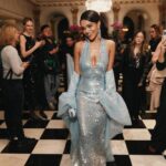 Rachel Zegler Instagram - For #RachelZegler’s second #MetGala ever, the soon-to-be star of Juliet on Broadway attended with @michaelkors in a shimmering baby blue gown that resembled flowing water in a garden fountain—with a frothy cape for a bit of extra drama. She got ready at the Pierre Hotel with her team, an impressive array of @diorbeauty, and her beloved dog, Lenny. She ended the night in a cozy sweatshirt (by Kors, of course). Click the link in the bio for more details on her getting-ready process. Photos: @emiliomadrid Styling: @sarahslutsky Hair: @claytonhawkins Makeup: @allanface