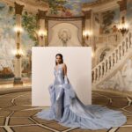 Rachel Zegler Instagram - For #RachelZegler’s second #MetGala ever, the soon-to-be star of Juliet on Broadway attended with @michaelkors in a shimmering baby blue gown that resembled flowing water in a garden fountain—with a frothy cape for a bit of extra drama. She got ready at the Pierre Hotel with her team, an impressive array of @diorbeauty, and her beloved dog, Lenny. She ended the night in a cozy sweatshirt (by Kors, of course). Click the link in the bio for more details on her getting-ready process. Photos: @emiliomadrid Styling: @sarahslutsky Hair: @claytonhawkins Makeup: @allanface