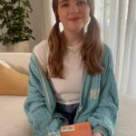 Raegan Revord Instagram - @Penguin_Teen #PenguinTeenPartner #Ad In this month’s book club pick, #EveryTimeYouHearThatSong by Jenna Voris, 17-year-old Darren Purchase is trying to get the scoop on the story of her idol, country music legend Decklee Cassel’s death. Following Decklee’s funeral, a time capsule left for her fans is revealed to be empty. It’s just the beginning of an elaborate scavenger hunt leading to a treasure trove of cash for whoever can find the true time capsule! Darren knows this story could launch her career as a journalist, and sets out to uncover the truth about Decklee, alongside the secrets surrounding her relationship with her longtime collaborator, songwriter Mickenlee Hooper. I loved the unique way the author chose to switch between Darren and Decklee’s perspectives—and jump through time in the process. I was so invested in Darren’s journey to uncover Decklee’s secrets, but I loved switching gears to hear about Decklee’s rise to fame and her relationship with her collaborator. Plus, which #Swifty doesn’t love a Taylor Swift egg hunt!? If you love country music or just want a great book that will tug at your heartstrings like guitar strings, I *highly* recommend this month’s book pick! 🎸🎙️ @jennavoris @penguinrandomhouse #ReadwithRaegan #bookstagram #readersofinstagram #bookreccomendations #BookClubFaves #bookrecommendations #music #teenromance #countrymusic #romance #taylorswift #swiftie