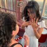 Raini Rodriguez Instagram – Happiest of birthdays to @ashleyargota9 🦋🦋 These two pictures of us were my favs from 2019…
1) We took this pic in the parking lot of Olive Garden after having a girls day. I knew @micktorres was going to propose to Ash in 3 days, so I took her to get a manicure because no friend should let her best friend get proposed to without her nails being polished! I was so nervous the whole day, I was worried I would give something away. 
2) I surprised her by being at her proposal when she walked in. It was a moment. All of the people who loved and cared about her and Mick, all on one rooftop. We all laughed and cried, then we went into a corner, just us two….& just stared at the ring on her finger. Who knew 10 years of friendship would bring us to that moment of my best friend becoming someone’s fiancée and her asking me to be her Maid of Honor. 
Life has a funny way of bringing and keeping the right people in your life. We have been through so much these last 10 years but through it all, our friendship never faltered. I love you best friend!! I hope you have the best birthday and year yet!! 🥳🥳💟💟