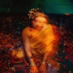 Raja Kumari Instagram - Gold … Water…. Flowers …. & the RAJAKUMARI …. Shoot diary … Styled by the super maddest and crazy @tryagaintoobad . . . . #colours #water #photoshoot #love #camera #music #artist #instagood #paintings #therajakumari #tejasnerurkarr