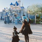 Rebecca Victoria Hardy Instagram - Dark paradise 🖤🦇🕸️ Ears: @batsday Jacket: @blackcraftcult #disneyland #gothicbaby #batsday #alt #goth #mommyandme