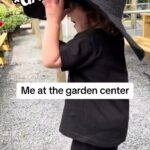 Rebecca Victoria Hardy Instagram - Green thumb, black heart 🌿🖤 shirt: Gothic Baby Collection at @blackcraftcult #gardening #gothichomedecor #gothicbaby #garden #springdecor #goth #alt #gothbaby Gothic baby garden center goth gardening spring