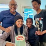 Renée Elise Goldsberry Instagram - I’ve been cranky on my birthday as long as I can remember. Too much pressure on this day to feel special, and that’s too much to ask of January 2nd—THE MOST SOBERING DAY OF THE YEAR. Feel sorry for my family on January 2nd. They try. They sing to me at some point, and I smile and say thank you, but my eyes can’t hide my disappointment that everyone everywhere is un-decking the halls and starting their diets on my day. This one didn’t start any better. My already sleep deprived family went to bed at 11pm last night because we had to catch a 6am flight home. I woke up at 1am to a drunken mob of Michigan fans who were screaming outside of our hotel room until 30 mins before our alarm. TSA chose THIS day to randomly test my hands, and for some strange reason I failed! My family looked on with pity as I was full and I mean FULL body groped at security like a terrorist, in front of hordes of strangers. ( I didn’t know they went under your shirt and waist band! Really guys?) But in the back middle of this plane I am on, the WiFi is working, and the happy birthday texts are coming through and reminding me how great this birthdate is. It’s so early in the year, a lot of people remember January 2nd! 1-2, Baby! And I always get a pre-birthday surprise party during New Year’s Day Dinner! That counts! So I’m posting my New Year’s Day pre-birthday cake, and the last moments of a spontaneous revival we had last night! (The bottle of wine opened for me was SOOOO good we had to call it communion!) I blew out that pre-birthday candle yesterday bursting with gratitude for my family and for my friends. I’m grateful that I’m never sad about getting older. I’m grateful for the MIRACLE of another year. Life is precious! Love is all around me! And there is still so much to celebrate! Even on the day after the parade! #january2 #embraceyourbirthday #thebloodthatgivesmestrength #itwillneverloseitspower