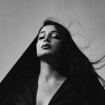 Richa Shukla Moorjani Instagram – I’ve never been more excited or proud to share anything than this – my wildly brilliant and unimaginably talented little sister @SheherazaadOfficial revealed her masterpiece of a debut album, “Qasr” (produced by the genius @aroojaftab ) today – available on Spotify/Apple. 🤲🏽🙏🏽 and it couldn’t have come at a more urgent time as an explicit call for the end of cultural erasure 

I’ve watched her since she was about 5 years old shock every human around her with her prodigious artistry, while she continued to cultivate and refine her voice as a performer, artist and activist. She has stayed  unapologetically true to herself and her unique ways of expression, despite everyone around her and the industry telling her to essentially cater to and be more accessible to a Eurocentric audience- something she has vehemently rejected in her fervent mission to reclaim our culture and homeland. In a time where we have basically been starved of *real* music with live orchestration combined with evocative lyrics that heal and inspire imagination, this genre-defying album is like an intoxicating tonic for the immigrant and diasporic soul. She will hate me for posting this and revealing that she’s my sister, but don’t care, I’m unashamedly her biggest fan 🖤 

“The album, produced by @AroojAftab and released via @ErasedTapesRecords, takes the listener on a journey through delicate flamenco guitar lines coupled with smoky vocals; jaunty, mischievous cinematic stringscapes; followed by nostalgic palm tree surf-rock; and finishes with a tumultuous culmination of intricate, playful, and frequently surprising orchestrations.

‘A haunting commentary on displacement, immigration and imagined homelands’— Vogue India “

“This is about delighting in our wickedness, especially as gender expansive people, where we’ve previously had little control over our sonic narrative in Hindi and Urdu music.” – @sheherazaadofficial