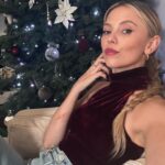 Riley Voelkel Instagram - Outfit from @revolve Scrape from falling through the attic Griswold style ✌️#revolve #holidayoutfit #truestory #loversandfriends #maybellineliftergloss