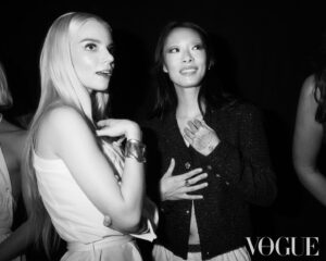 Rina Sawayama Instagram - @britishvogue ❤️

photographed by @NedRogers and styled by @Edward_Enninful, my glam @frankieboyd @evaniefrausto, wearing @chanelofficial 

[Image Description: Slide one, a black and white image shows, from left to right, Gemma Chan, a woman of Chinese heritage, Simone Ashley, a woman of Indian Tamil heritage, Rina Sawayama, a woman of Japanese heritage, Anya Taylor-Joy, a white woman, Maya Jama, a Black woman, Paloma Elsesser, a Black woman, and Jameela Jamil, a woman of Indian and Pakistani heritage. Simone, Anya and Paloma are sitting on stools, and the other women are standing. All seven are looking at one another and laughing.