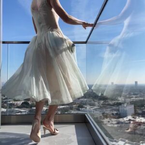 Rosamund Pike Instagram - Days of wine and roses. Long have I wished to wear a dress by @simonerocha_  This felt whimsical and witty and painterly for the @bafta tea party at the Maybourne Hotel which was on a terrace decorated with red roses! 

Thank you @leithclark for the joy, @kyleeheathhair for the beautiful bun @tamah_krinsky for the face magic. And @prosper_pr for it all.