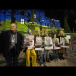 Rosamund Pike Instagram - Proud to participate in a peaceful demonstration outside the Russian Embassy in London tonight. Paul Conroy @reflextv @waadalkateab, me and other members of the @frontlineclub held aloft photographs of 5 journalists - Pierre Zakrzewski, Viktor Dudar, Yevhenii Sakun, Oleksandra Kuvshynova and Brent Renaud - killed in Ukraine this past week, their faces held up high in front of the Ukrainian flag which was emblazoned across the front of the embassy by a team projecting from a van parked across the street. The Embassy was lit up in blue and yellow and we called for the targeting of journalists - who bring us the truth and risk their lives doing so - to be stopped. It is the speaking of truth that is so threatening to those in power. #straightfromthefrontline In memory of #Yevheniisakun #pierrezakrzewski #viktordudor #oleksandrakuvshynova #brentrenaud