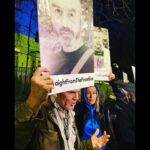 Rosamund Pike Instagram - Proud to participate in a peaceful demonstration outside the Russian Embassy in London tonight. Paul Conroy @reflextv @waadalkateab, me and other members of the @frontlineclub held aloft photographs of 5 journalists - Pierre Zakrzewski, Viktor Dudar, Yevhenii Sakun, Oleksandra Kuvshynova and Brent Renaud - killed in Ukraine this past week, their faces held up high in front of the Ukrainian flag which was emblazoned across the front of the embassy by a team projecting from a van parked across the street. The Embassy was lit up in blue and yellow and we called for the targeting of journalists - who bring us the truth and risk their lives doing so - to be stopped. It is the speaking of truth that is so threatening to those in power. #straightfromthefrontline In memory of #Yevheniisakun #pierrezakrzewski #viktordudor #oleksandrakuvshynova #brentrenaud