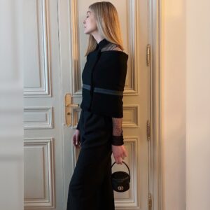 Rosamund Pike Instagram - Two different types of armour. Each it’s own type of PPE.  The MAG PPE is worn by women all over the world enabling them to conduct this live changing work, building futures for their communities. @mariagraziachiuri at @dior not only creates clothes which provide a symbolic armour, she uses her platform to support communities of women across the globe,  committing to building futures in many parts of the world.