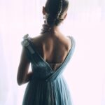 Rosamund Pike Instagram - 2 weeks since the @bafta film awards in London. I flew from Cape Town where I am working, and slipped back into London life for 2 days; or at least a fantasy version of London life where I dressed in Dior, and got ready at the Ritz, and borrowed playfully exquisite jewellery from Boucheron … a fantasy life, which is not mine, and which will always have its Cinderella moment when the coach turns back into a pumpkin. But that is part of the story. Magical, because when you’re back in a hoodie queuing for an 11 hour Monday night flight from Heathrow, you wonder if any of it was real. These photographs, shot by Simon Emmett, are from while the magic lasted! Look at the Boucheron bow inspiring the bow in my hair; and the way this dress moves!! A liquid silk that flows so beautifully, and a colour that seems to glow. A dress to lose in! And get got lost in. @theritzlondon @bafta @dior @boucheron @davidebarbieri_ @amanda.grossman @leithclark @simonemmettstudio