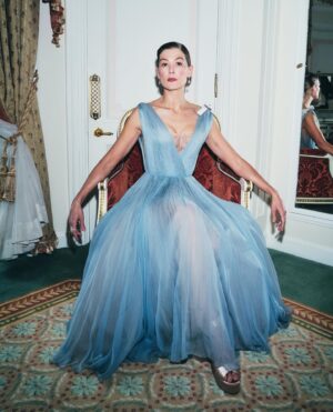 Rosamund Pike Instagram - 2 weeks since the @bafta film awards in London. I flew from Cape Town where I am working, and slipped back into London life for 2 days; or at least a fantasy version of London life where I dressed in Dior, and got ready at the Ritz, and borrowed playfully exquisite jewellery from Boucheron … a fantasy life, which is not mine, and which will always have its Cinderella moment when the coach turns back into a pumpkin. But that is part of the story. Magical, because when you’re back in a hoodie queuing for an 11 hour Monday night flight from Heathrow, you wonder if any of it was real. These photographs, shot by Simon Emmett, are from while the magic lasted! Look at the Boucheron bow inspiring the bow in my hair; and the way this dress moves!! A liquid silk that flows so beautifully, and a colour that seems to glow. A dress to lose in! And get got lost in. 
@theritzlondon 
@bafta 
@dior 
@boucheron 
@davidebarbieri_ 
@amanda.grossman 
@leithclark 
@simonemmettstudio