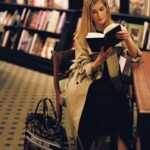 Rosamund Pike Instagram - Amidst the plethora of treasures discovered, one gem sparkled the brightest – the joy of being in a bookshop with no one around. As we bid farewell to the second edition of Book Tote Club, our House friend @MsPike carrying her #DiorBookTote by @MariaGraziaChiuri embraced the enriching experience of traveling the world while sitting still, in the presence of captivating company found within the realm of literature. © @MarionBerrin