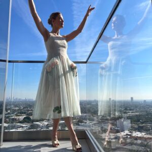 Rosamund Pike Instagram - Days of wine and roses. Long have I wished to wear a dress by @simonerocha_ This felt whimsical and witty and painterly for the @bafta tea party at the Maybourne Hotel which was on a terrace decorated with red roses! Thank you @leithclark for the joy, @kyleeheathhair for the beautiful bun @tamah_krinsky for the face magic. And @prosper_pr for it all.