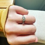 Sara Bareilles Instagram – We have been engaged for a year and this is the ring we chose- we picked it up yesterday. We bought the gold leaf at an arts fair in Mexico City last December because looking for a ring started to feel like it was distorting and eclipsing the beauty of choosing each other. Joe found this ring at an antique store upstate. I was buying tiny lamp shades. (So cute!) It didn’t fit my finger so I was scared to take the leap. I had been thinking I should go get something custom or really hunt for the “right ring” so I balked at it. We drove back to our house without it and talked about the concept of the ring. That it is something he wants to give me, not just get for me. That the leap of faith of not quite knowing if it was “the one” is just that. A leap of faith. And isn’t that life? I look at this ring and think of his big blue eyes and how sometimes they are pleading with me to let go and grow into something new with him. So I did. And we got it the next day and got it sized and now I just love that I see him when I look at it- I like looking at you @joetipps. 

Exceptional “hand holding things” pictures were taken by me. Please credit me I’m a very important photographer.