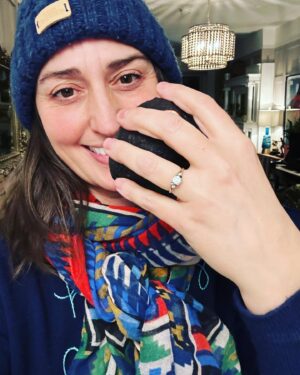 Sara Bareilles Instagram - We have been engaged for a year and this is the ring we chose- we picked it up yesterday. We bought the gold leaf at an arts fair in Mexico City last December because looking for a ring started to feel like it was distorting and eclipsing the beauty of choosing each other. Joe found this ring at an antique store upstate. I was buying tiny lamp shades. (So cute!) It didn’t fit my finger so I was scared to take the leap. I had been thinking I should go get something custom or really hunt for the “right ring” so I balked at it. We drove back to our house without it and talked about the concept of the ring. That it is something he wants to give me, not just get for me. That the leap of faith of not quite knowing if it was “the one” is just that. A leap of faith. And isn’t that life? I look at this ring and think of his big blue eyes and how sometimes they are pleading with me to let go and grow into something new with him. So I did. And we got it the next day and got it sized and now I just love that I see him when I look at it- I like looking at you @joetipps. 

Exceptional “hand holding things” pictures were taken by me. Please credit me I’m a very important photographer.