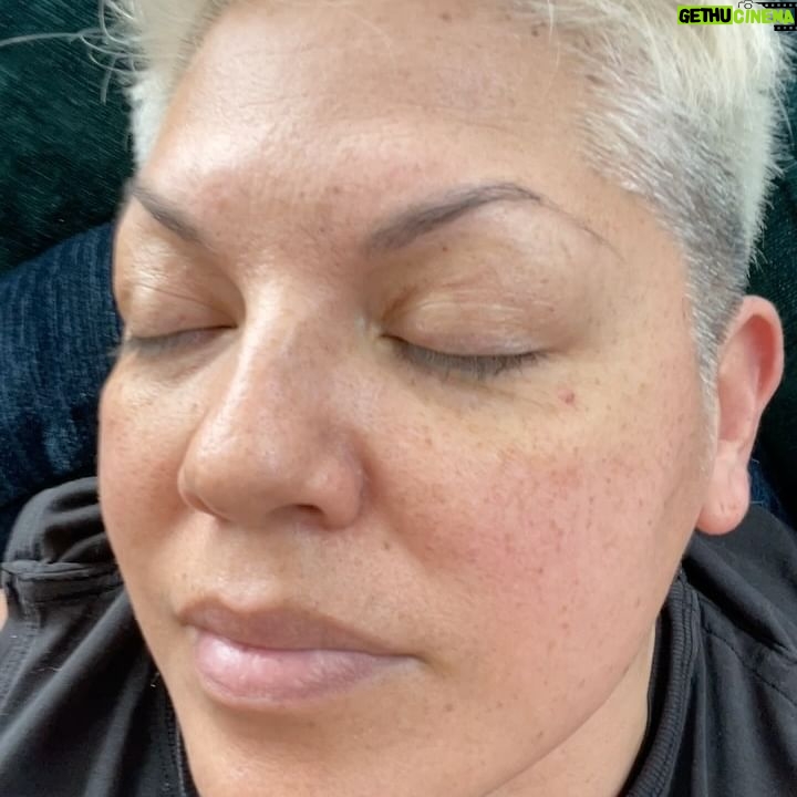 Sara Ramirez Instagram - As much space as I make for anger/rage/sadness, it is imperative that I make as much- if not more- space for joy and pleasure. I’m a human being who deserves love, joy, pleasure, silliness, fun, and for my whole self to be accepted and respected. Here is some of my joy in recent days! . . Pic 1: selfie of me squinting in the sun cosplaying Billy Idol with a curled lip, recently changed hair to platinum, laying on a towel with my sunglasses and Parable of the Sower (yes! It took me forever to read it! Yes! I struggle with staying focused when reading! :)) as I soak in the first rays of Spring. Pic 2: Mio in the midst of capturing one of his fave toys in his mouth. Pic 3: Me and Sawyer selfie, out and about having fun! He’s got cute glasses on and an olive beanie. I’m, of course, wearing black. Pic 4,5,6: beautiful blooming Spring at Brooklyn Botanical Gardens, Sawyer taking a pic, and a video of gorgeous reds blooming. Pic 7: my red nails for Red Ink at Joes Pub. I wonder why my middle finger nails are watermelon art? 🤔🍉 Pic 8,9: selfies of me and @trudy0nduty at the park loving on each other with hugs and smooches. Big bright yellow blooming behind us. Video: me being silly, making my own music, being in on all the jokes. We must have JOY to counteract and resist the systems that would rather we didn’t exist. 👋🏽🥰❤️🔥☀️🪻🌱