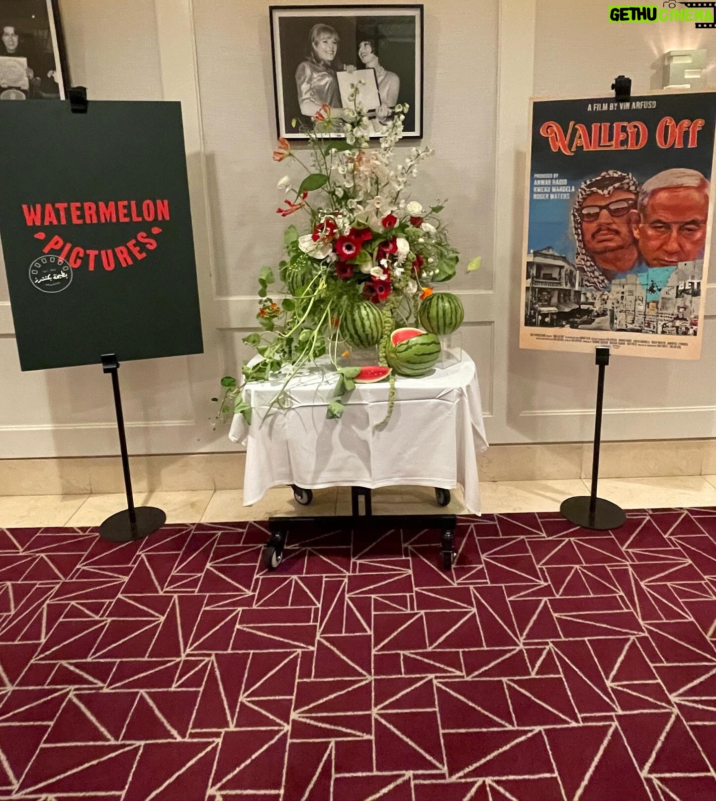 Sara Ramirez Instagram - Thank you @lanzybear and @watermelonpicturesco for welcoming us to this intimate screening of Walled Off; an incredibly powerful, moving, educational and galvanizing film by @vinarfuso , produced by @anwarhadid @rogerwaters @kwekumandela and Immortal Technique, that centers Palestinian humanity and stories over numbers, and shows the Palestinian perspective on how the ongoing Nakba continues today. Available on all digital platforms MAY 3rd. Spread the word! . . Pic1: @qween_jean and I in the screening room, smiling because it feels good to be with likeminded creative community. Video1: The beautiful flower and watermelon arrangement in the entrance to the screening room, a poster of Watermelon Pictures on the left of the arrangement and to the right is a poster of Walled Off. Pic2: wide pic of the above. Video2: panning the entrance to the screening room, all the beautiful creative community in support of this film and Watermelon Pictures. Video3: selfie video of Qween and I with screening entrance room and community in the background, exclaiming “Solidarity!” “Watermelon Pictures!” “FREE PALESTINE” with Alana’s sister joining us toward the end. Pic3: my hand holding up a black Watermelon Pics swag bag that reads “FROM THE RIVER TO THE SCREEN PALESTINE WILL BE SEEN” (obsessed) in English and Arabic, English in white, Arabic in red. Video4: @munir_atalla who is part of the @watermelonpicturesco team, welcoming us inside the screening room and asking who here is Palestinian. The crowd erupts in a loud “WOOO”. Then he says “For all of you who didn’t go ‘wooo’, you are wrong because if you were invited here you are a part of our movement. In our thousands in our millions, we are all Palestinians. And so let’s hear it one more time- Who here is Palestinian?” Everyone erupts in an even louder “WOOO!”. Then Qween exclaims “Viva Viva Palestina!” The crowd laughs and enjoys it! Munir says “Yes.” Pic4: @lanzybear and Walled Off filmmaker @vinarfuso sitting at the front of the room in a talk back with the audience. So so powerful and appreciated! . They tried to bury us. They didn’t know we were seeds. 🌱🍉❤️🔥