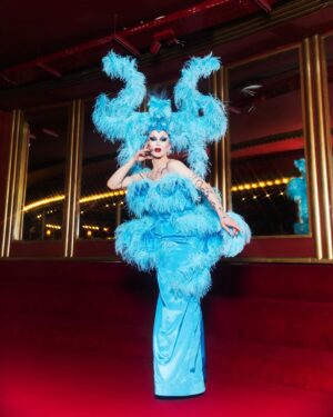 Sasha Velour Instagram - Merci Paris 🦋💎🌹

An extravagant moment in life— wearing a custom @serand_create dress and headpiece for my sold-out show at the @foliesbergere_officiel, channelling the original showgirls of Paris with an extra camp twist…all while traipsing about the haunted theatre with photographer @mettieostrowski to get these incredible photos! I might have cried a little. 

Plus I loved sharing the stage with the queen of FRANCE @thenickydoll! All around a dream come true. Merci bien!