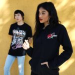 Selena Quintanilla Instagram - 𝐍𝐄𝗪 𝐒𝐄𝐋𝐄𝐍𝐀 𝐌𝐄𝐑𝐂𝐇 𝐍𝐎𝗪 𝐀𝐓 @Hottopic!⁣ ⁣ Shop Black Friday Sale Today.⁣ ⁣⁣⁣ ⁣Tees $12 Hoodies & Pullovers - Buy One, Get One $10! ⁣ ⁣ 𝐋𝐢𝐧𝐤 𝐢𝐧 𝐛𝐢𝐨.