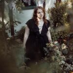 Shannon Purser Instagram – O October! Blanket me in auburn leaves and dappled sun. Speak to me in spectral winds and warm spice. Let me be not afraid of the darkness. Let me welcome the unknown to my hearth as an old friend and take its hand. Let the whispering ghosts both ancient and new come to greet me. I am a wandering spirit just like you. 🕸⚰️🖤🎃

•photos: @susieq•
•hair/makeup: @blondiewoodbeauty• 
•clothing/location: @michelinepitt @la_femme_en_noir_•
