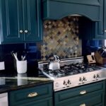 Sharna Burgess Instagram – Merry Christmas to me 🤩🤩 Kitchen rehab present from Bri. Thank you baby for knowing me so well this was THE best present ever. 

I am in love with this rich deep green color AND the hardware AND I even love the counter top now :) Its unreal what the right paint and little details can do. The placement of the handles is amazing too. We were about to do black because I love a black and white kitchen but it didn’t feel right in this space with the counter top and the moulding on our cupboard doors. This green feels like we’re embracing all the quirks that instead of hiding them. We’re on the search for the perfect island too. 

I know this is the lipstick version but wow am I obsessed. Thank you @brianaustingreen I love you so much and now I love our kitchen too! 😘♥️

#christmas #present #kitchendesign #homedecor #greenkitchen