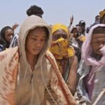 Sharon Ooja Instagram - Oloture 2 the journey is coming !!! Very soon exclusively to Netflix our favs !!❤️ As you can see from these pictures I lost myself and got into character !!!! This journey was acrosss the desert !! My character continued her perilous journey through the hostile lands of Niger and Libya to the Mediterranean as she desperately tried for find her way out !!! The team behind this work gave it our all I mean every one of us !!!! When I say we gave it our all I mean we did !!!!! I mean the desert took its toll on us but when I say it made us produce something soooooo amazing yall aren’t even ready shout out to the entire team we became family and we made massive magic like never before !!!!! @moabudu I won’t stop saying thank you for all you do because you are a king maker and I love you for all you do behind the scenes and in front of the scenes!!! You rock !!! Shoutout to my family on set my director @kennethgyang @inemking @heidiwena