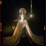 Shea Couleé Instagram - I’m this month’s cover star for @totem_magazine 🤩 Had such a great time working on this editorial with such a brilliant team. The concept was A.I. Joan Of Arc. We wanted to juxtapose this historical figure with the ongoing developments of A.I. and the way it is perceived by society as a whole. Like most polarizing things, it’s often good until someone decides that it a problem. Similarly to the ongoing threats waged against drag in America. Check out the link in my story to read the full article! Creative Director, Photographer & Light Artist @eivindhansen Styling & Costume Design @juicylames @agrostudio_ Set Design @mariashrigley Hair @sheacoulee Makeup @candy_puxe Director of Photography (DOP) @vlad_jako  1st Assistant Director @marietheresehildenbrandt Photographer Assistant @selinejoh Set Assistant nyk_mensah Makeup Assistant @mistraty Styling Assistants @kaydmfreud @daniellenevin Talent assistant @brendon_brown_ Nail @brixton_klaws Nails @bbygirlnails Lighting Sponsored by Nanlite UK - @Nanlite_UK Studio: @interlude.london The Avatar ● Dress: Maximilian Raynor - @maximilianraynor The Cleric ● Dress: Zhujing（Deni) Dai - @zjingdai_deni ● Corset: AGRO STUDIO - @agrostudio_ ● Hat: Hat & Spicy - @hat.n.spicy ● Armour: Costume Studio - costume_studio_london ● Shoes: Maximilian Raynor - @maximilianraynor The Sorceress ● Feather Headpiece: Vivienne Lake - @viviennelake_ ● Jewellery: Amy Rodriguez - @amy____rodriguez ● Boots: Lucy James @juicylames ● Dress: Daiana Ion - ddainaa_ ● Top: Louise Webber - @louisewebber.design The Pyromancer ● Top: Paul Aaron - @paulaaronknitwear ● Skirt: Lucy James @juicylames ● Jewellery: Baba Roga Jewellery - @babarogastore