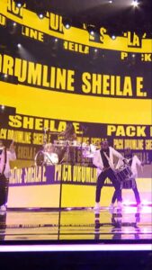 Sheila E. Instagram - @sheilaedrummer with @thepackdrumline and @v.unbeatable_official_india is a collective SLAY!! 🥁 🎶 Watch #AGT: Fantasy League on @NBC and streaming on @peacock.