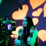 Sheri Moon Zombie Instagram - Lily is swooning over Herman💜 #TheMunsters #behindthescenes #livenotgreenscreen