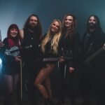 Sophie Lloyd Instagram - The music video for Imposter Syndrome (feat. @officiallzzyhale) is OUT NOW on my YouTube channel! Thankyou so much to everyone that worked so hard on this video, and thankyou to all of you guys supporting me so I can create things like this! Go and check it out on my YouTube channel NOW!! 📷 @nathersonn 🎥 @videoink_ 🥁 @painter_1989 🎸 @adamdarat 🎻 @natwillowviolin 💄 @in.templum.ophelia #impostersyndrome #sophielloyd #lzzyhale #halestorm #sophieguitar #newmusic #rockmusic #guitaristsofinstagram #rocknroll #girlguitarist #newrock #rockguitarist #guitarist #videoink